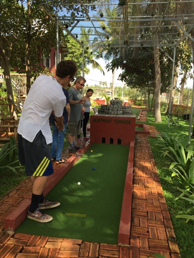 People playing mini-golf in Siem Reap, Cambodia.