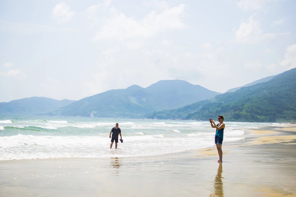 People admiring and taking pictures of the scenery around Lang Co Beach in Hue, Vietnam.
