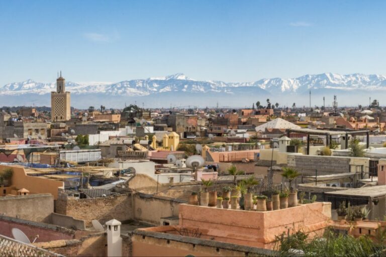 The city of Marrakech, Morocco with a mountain range behind it