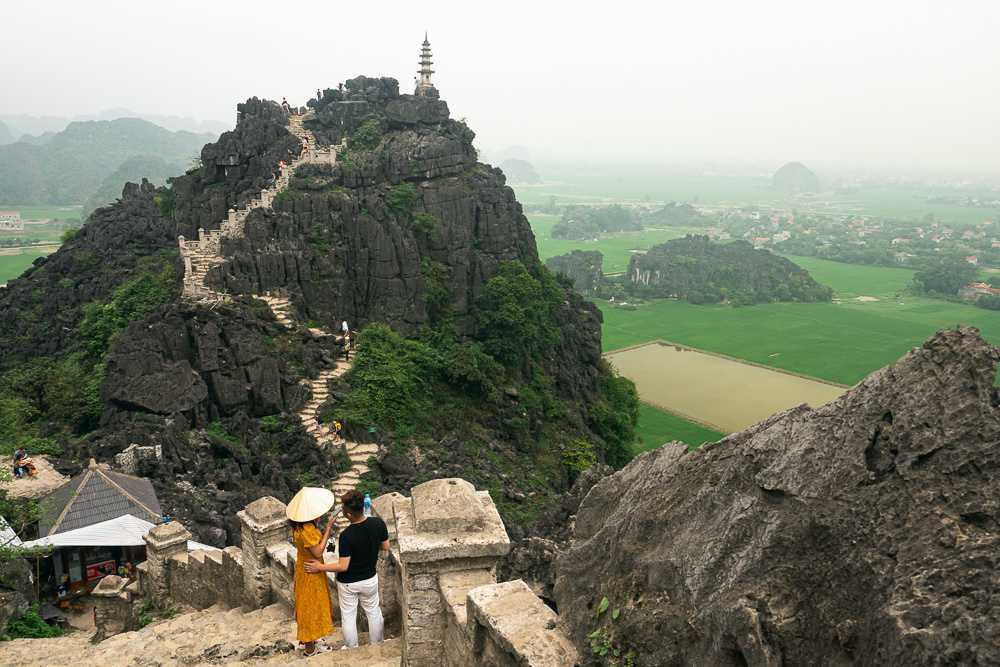 The stairs to a temple on a rocky mountain in Ninh Binh, Vietnam.