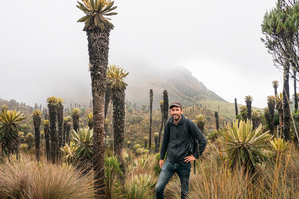 A man standing in front of a mountain on a chilly day