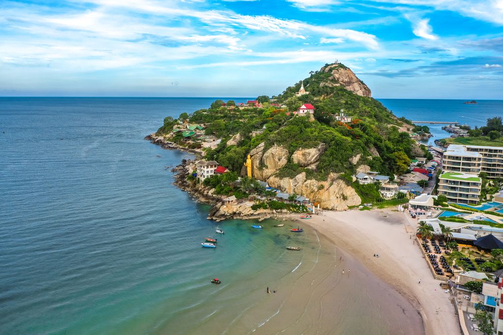 An island coast near Hua Hin, Thailand with a Buddha statue.